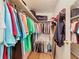 Spacious walk-in closet providing ample storage with shelving and hanging space for clothes, shoes, and accessories at 824 Silver Oak Ave, The Villages, FL 32159