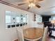 Dining room with a dining table, seating for four and views into the living room at 824 Silver Oak Ave, The Villages, FL 32159