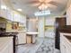 Well-lit kitchen with ample storage, modern appliances, and a cozy dining area at 824 Silver Oak Ave, The Villages, FL 32159