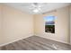 Spacious bedroom with wood-look floors and ceiling fan at 3435 Arabesque Dr, Deland, FL 32724