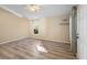 Spacious bedroom with wood-look tile flooring and large window at 3435 Arabesque Dr, Deland, FL 32724