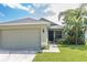 House exterior view featuring a garage and walkway at 3435 Arabesque Dr, Deland, FL 32724