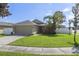 Front yard view of a single story house with a green lawn at 3435 Arabesque Dr, Deland, FL 32724