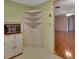 Corner of a kitchen with a microwave and a cream-colored cabinet at 47 Villa Villar Ct # 470, Deland, FL 32724