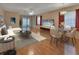 Bright living room featuring a dining area, a sliding glass door, and modern decor at 47 Villa Villar Ct # 470, Deland, FL 32724
