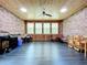 Enclosed brick patio featuring a wood ceiling and floor with natural light, perfect for outdoor entertaining at 106 N Frederick St, Pierson, FL 32180
