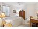 Bedroom with a queen-size bed and wood storage cabinet at 210 Brookgreen Way, Deland, FL 32724