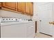 Laundry room with washer, dryer, and cabinets at 210 Brookgreen Way, Deland, FL 32724