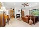 Living room with a fireplace, hardwood floors, and comfy seating at 210 Brookgreen Way, Deland, FL 32724