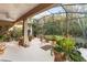 Relaxing screened porch with lush landscaping and plenty of plant life at 210 Brookgreen Way, Deland, FL 32724