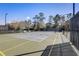 Well-maintained tennis court with surrounding fencing at 210 Brookgreen Way, Deland, FL 32724