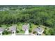 Aerial view of the neighborhood, showcasing lush green trees and well-maintained homes at 317 Nowell Loop, Deland, FL 32724