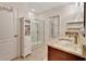 Bathroom featuring a shower with glass doors, tiled floors, and a granite countertop at 317 Nowell Loop, Deland, FL 32724