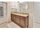 Bathroom featuring a double sink vanity with granite countertops and dark wood cabinets at 317 Nowell Loop, Deland, FL 32724
