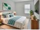 Bright bedroom with a large bed, contemporary decor, and ample natural light at 317 Nowell Loop, Deland, FL 32724