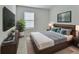 Cozy bedroom featuring a king-sized bed, modern decor, and a calming color scheme at 317 Nowell Loop, Deland, FL 32724