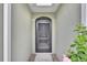 Covered entryway with door and sidelights at 317 Nowell Loop, Deland, FL 32724