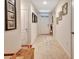 Inviting hallway with tiled floors, decorative wall art, and plenty of natural light at 317 Nowell Loop, Deland, FL 32724