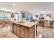 Modern kitchen island with granite countertops, stainless steel appliances, and an open floor plan at 317 Nowell Loop, Deland, FL 32724