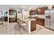 A kitchen featuring dark wood cabinets, granite countertops and stainless steel appliances at 317 Nowell Loop, Deland, FL 32724