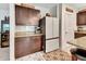 A kitchen featuring dark wood cabinets, granite countertops and stainless steel appliances at 317 Nowell Loop, Deland, FL 32724