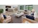 Bright living room boasts natural light, modern furniture, stylish decor, and an open-concept design at 317 Nowell Loop, Deland, FL 32724