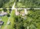 Aerial view of property highlighting homes, nearby wooded areas, roads, and surrounding neighborhood at 4205 Quail Ranch Rd, New Smyrna Beach, FL 32168