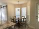 Charming dining area featuring a round wooden table with seating for four near bright windows at 4205 Quail Ranch Rd, New Smyrna Beach, FL 32168