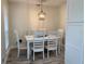 Bright dining room with a white table and seating for six, offering a clean and modern aesthetic at 4205 Quail Ranch Rd, New Smyrna Beach, FL 32168