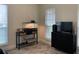 Comfortable living room featuring a pet habitat next to a modern black dresser and a sunlit window at 4205 Quail Ranch Rd, New Smyrna Beach, FL 32168