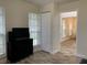 Bright living room showing a large window with a view to an adjoining dining area at 4205 Quail Ranch Rd, New Smyrna Beach, FL 32168