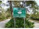 Lake Ashby Park sign with playground, picnic area, camping and nature trails at 4205 Quail Ranch Rd, New Smyrna Beach, FL 32168