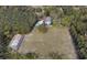Expansive aerial view of Arroyo Vista property featuring the main house, pool, barn, and surrounding landscape at 1440 Arroyo Vista Dr, Deland, FL 32724