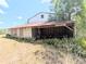 Open barn structure with storage space, ideal for equipment and covered parking at 1440 Arroyo Vista Dr, Deland, FL 32724