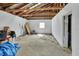 Unfinished room inside of a barn featuring a window, concrete floor, and exposed rafters at 1440 Arroyo Vista Dr, Deland, FL 32724