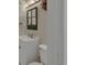 Bathroom featuring a white vanity, decorative mirror, and neutral wall color at 1440 Arroyo Vista Dr, Deland, FL 32724