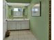 Bright bathroom features double sinks and a window providing natural light at 1440 Arroyo Vista Dr, Deland, FL 32724