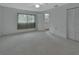 Spacious carpeted bedroom featuring a large window and closet for ample storage at 1440 Arroyo Vista Dr, Deland, FL 32724