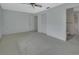 Bright carpeted bedroom with closet, doorway to bathroom, and ceiling fan at 1440 Arroyo Vista Dr, Deland, FL 32724