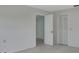 Bedroom featuring plush carpet, open doorway, and closet at 1440 Arroyo Vista Dr, Deland, FL 32724