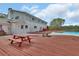 Expansive wooden deck overlooking the pool, perfect for picnics and outdoor gatherings at 1440 Arroyo Vista Dr, Deland, FL 32724