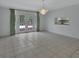 Open dining space featuring tile flooring, a chandelier, and doors to the exterior at 1440 Arroyo Vista Dr, Deland, FL 32724