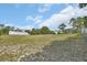 Expansive lot featuring mature trees and a structure, offering privacy and space for outdoor activities at 1440 Arroyo Vista Dr, Deland, FL 32724