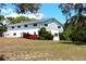Two story home with a wooden deck, large yard and partially wooded lot at 1440 Arroyo Vista Dr, Deland, FL 32724