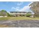 View of large house with mature landscaping, offering a peaceful and inviting curb appeal at 1440 Arroyo Vista Dr, Deland, FL 32724