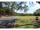 Lush front yard with a long driveway, offering ample parking and curb appeal at 1440 Arroyo Vista Dr, Deland, FL 32724