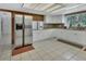 Bright kitchen featuring white cabinets, granite countertops, and stainless steel appliances at 1440 Arroyo Vista Dr, Deland, FL 32724