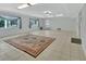 Spacious living room with tile flooring and natural light from the windows at 1440 Arroyo Vista Dr, Deland, FL 32724