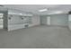 Expansive living area with wall mirror, neutral carpet and ample lighting at 1440 Arroyo Vista Dr, Deland, FL 32724