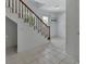 Bright stairwell with tiled flooring and white walls, creating a simple transition to other spaces at 1440 Arroyo Vista Dr, Deland, FL 32724